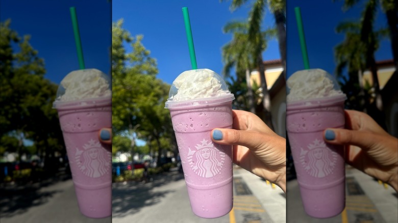 Someone holding a pink cotton candy Starbucks drink