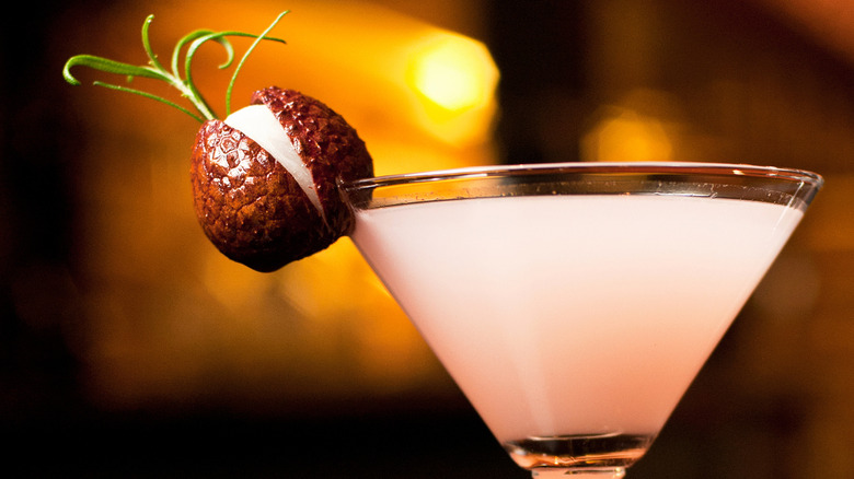 Lychee martini with lychee fruit garnish