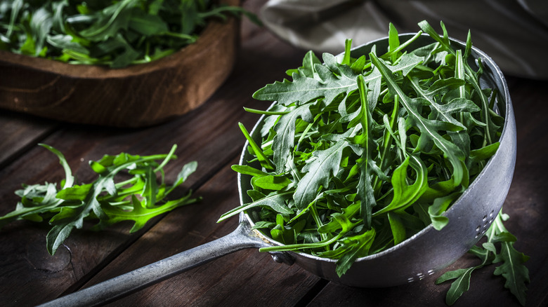 Colander full of arugula 