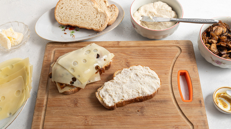 making sandwich on cutting board