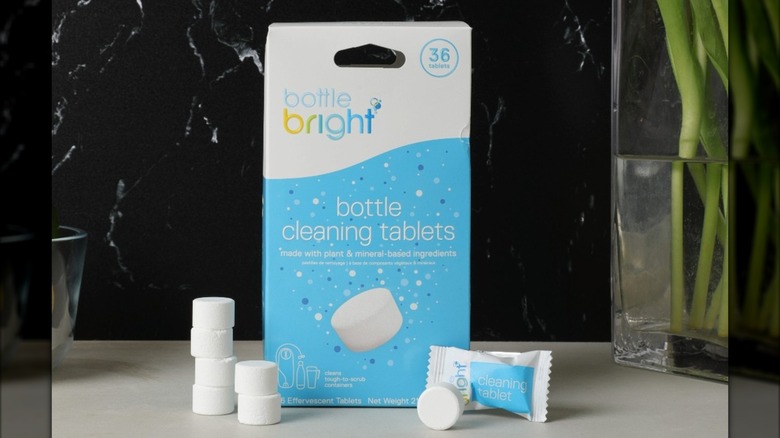 A box of Bottle Bright cleaning tablets next to open tablets on counter