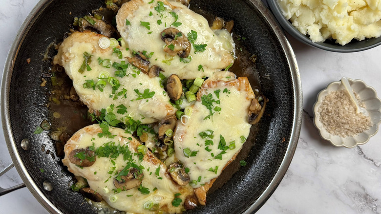 chicken with cheese in frying pan