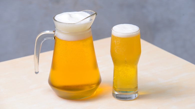 glass pictured next to pitcher
