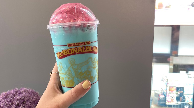 Hand holding milkshake