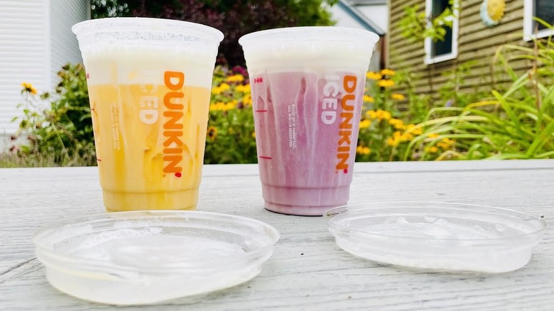 New Dunkin' Daydream Refreshers with  sitting on outdoor deck with lids off