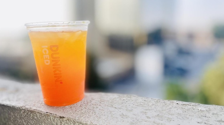 Dunkin' Golden Hour Refresher sitting on ledge