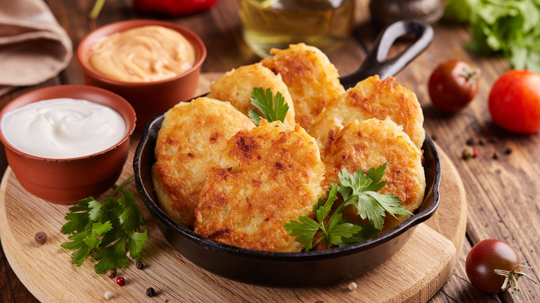 Hash brown patties with herbs and dipping sauces
