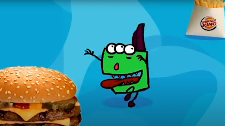 A Honbatz, Burger King's group of animated monsters, running toward a Whopper