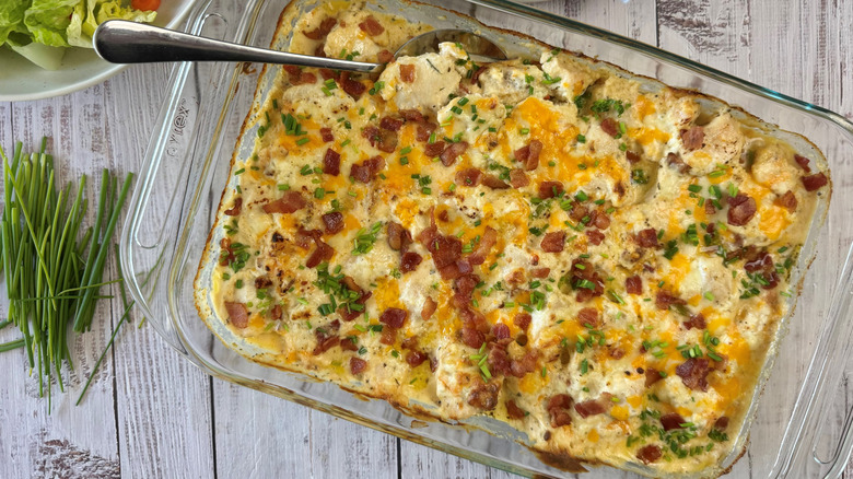 cheesy creamy chicken casserole with spoon