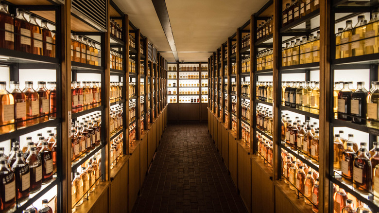 Shelves with lots of bottles of whiskey
