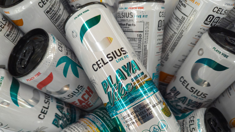 A pile of various Celsius energy drink cans