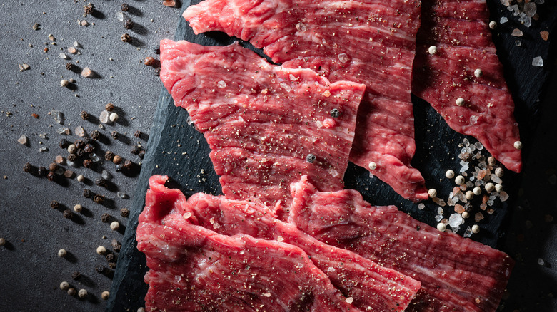 Thinly sliced steak seasoned with salt and pepper.