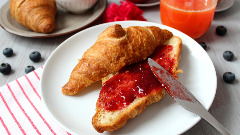 Toasted croissant with red jam