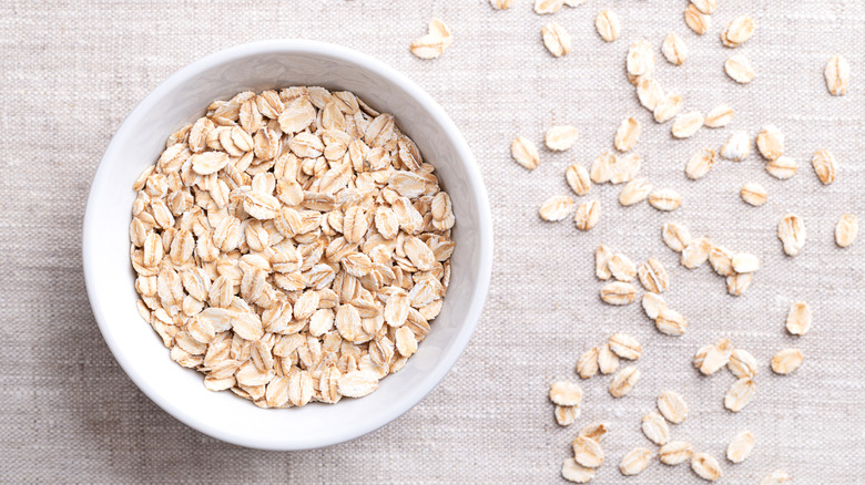 A bowl of oats in a bowl on a tablecloth