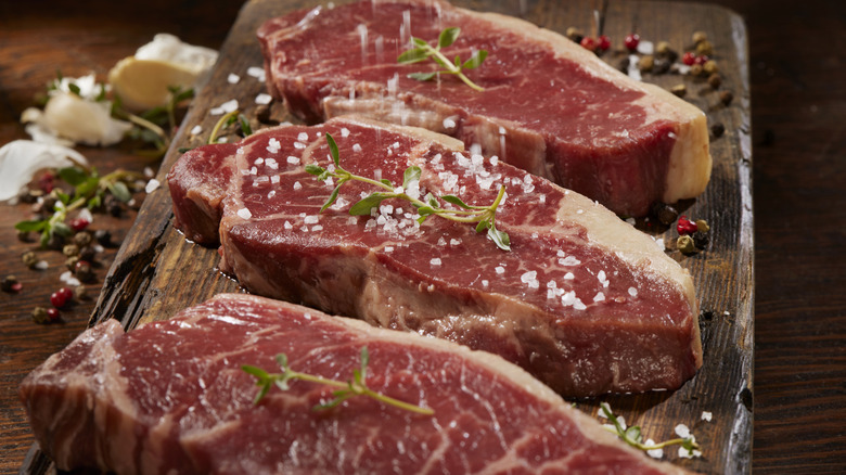 Lean New York strip steaks with salt and herbs