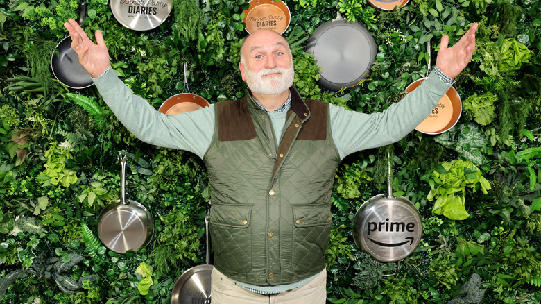 José Andrés smiling arms lifted