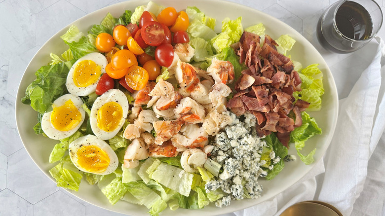 cobb salad with lobster on plate