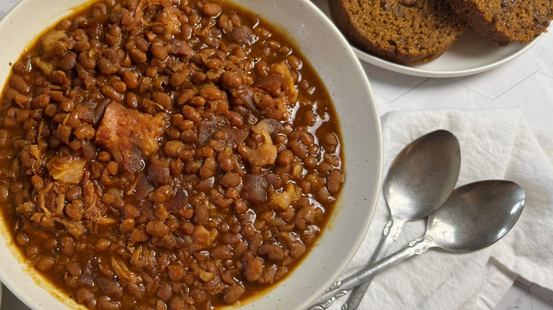 bowl with baked beans and two spoons