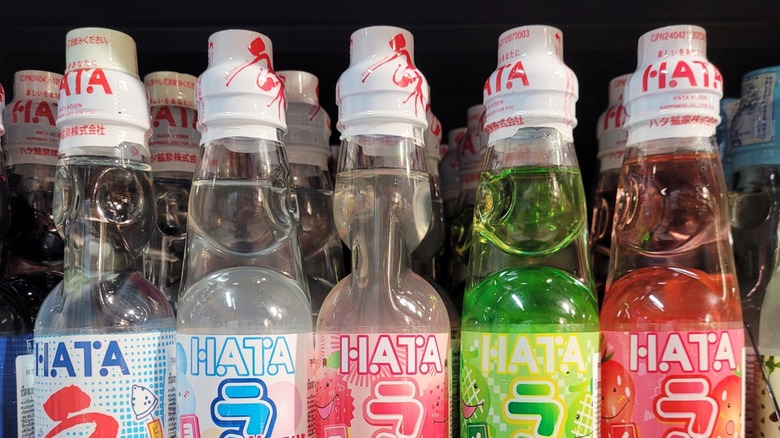 Five different colored ramune soda bottles