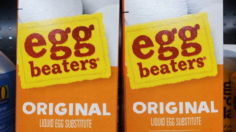Two original Egg Beaters cartons sit on a shelf at a grocery store
