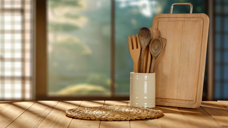 Wooden utensils sitting in container on countertop