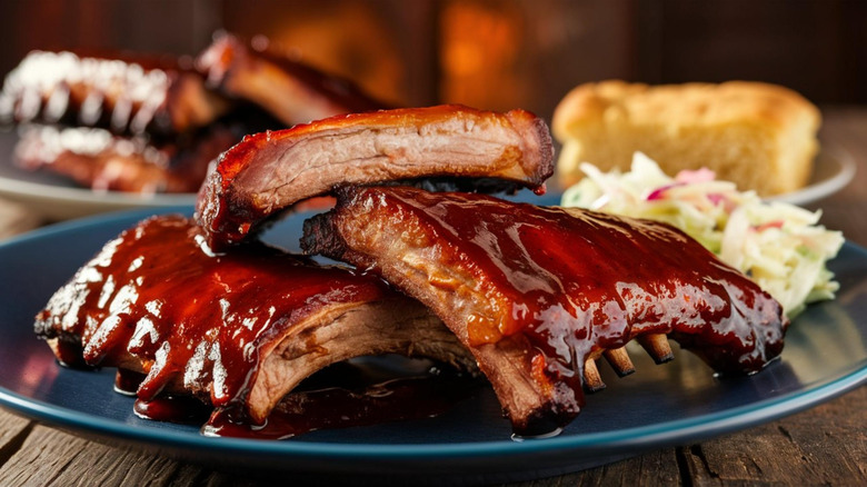 Tender and juicy barbecue ribs with sauce on plate