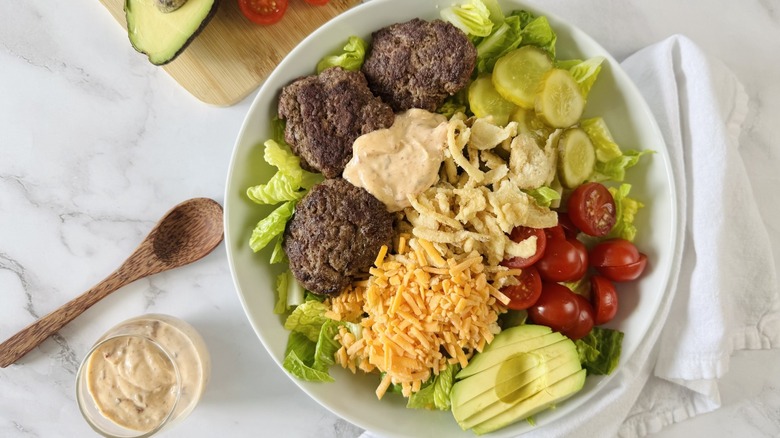 salad with burger patties