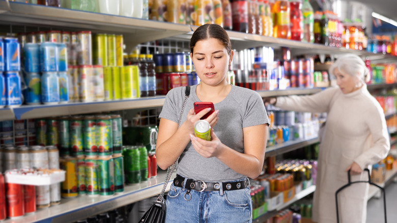 buying soda in grocery store