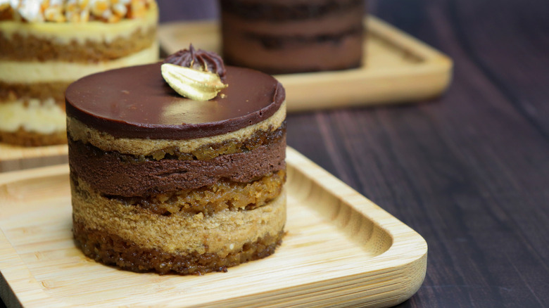 A small multi-layered chocolate cake