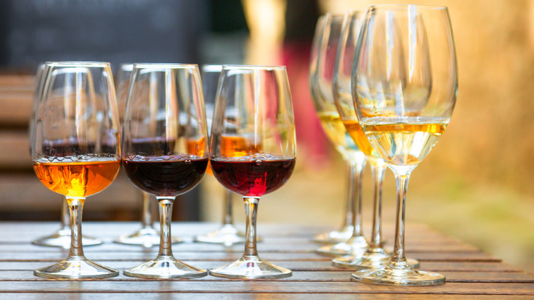 Selection of different colored port wines in a row