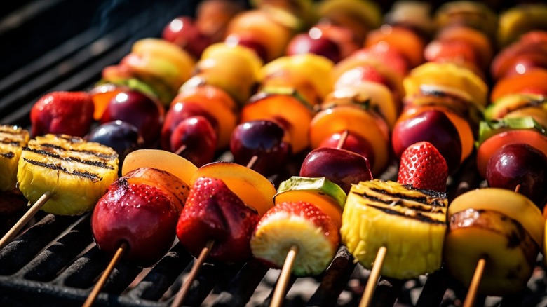 Skewered fruit on a grill