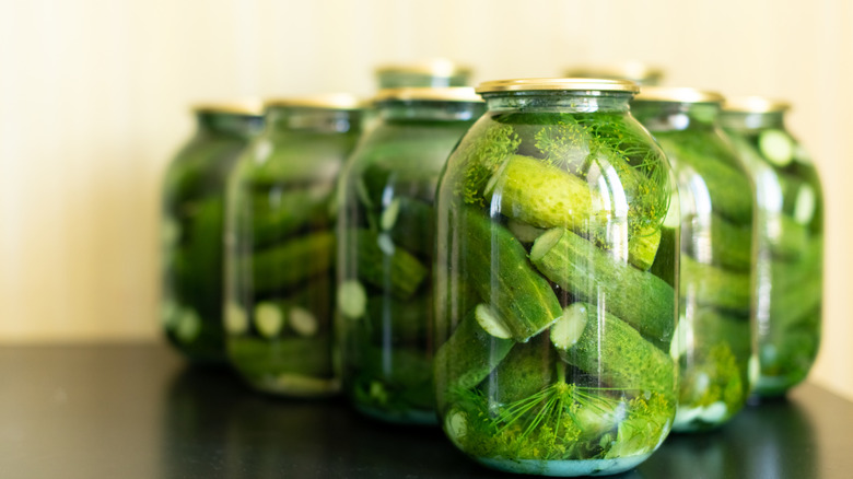 pickled cucumbers in several jars