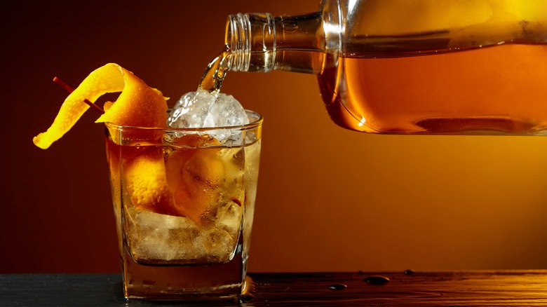 Bourbon being poured into a glass.