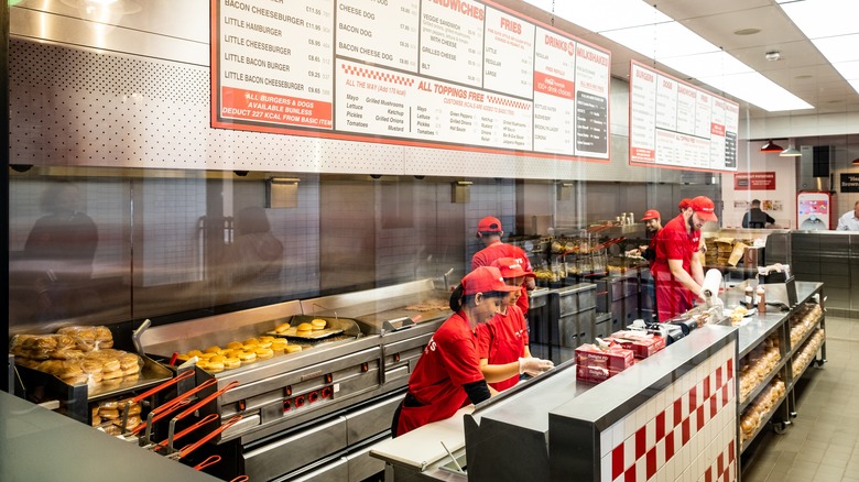 Five Guys employees working at restaurant