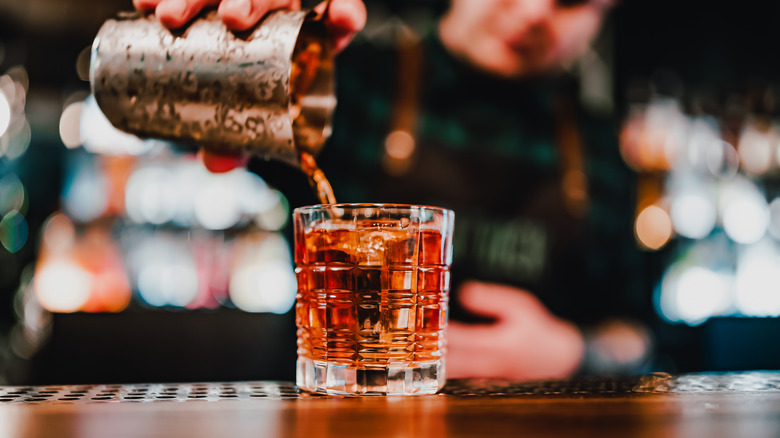 Bartender crafting a Negroni