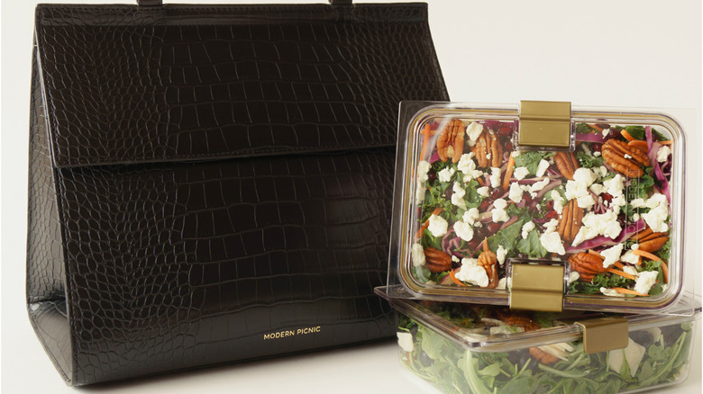 A Modern Picnic bag next to salad in containers