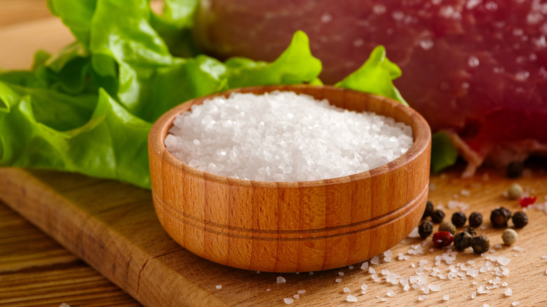 salt cellar pictured on cutting board