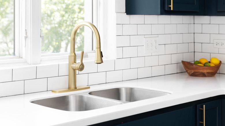 Kitchen sink and subway tile backsplash