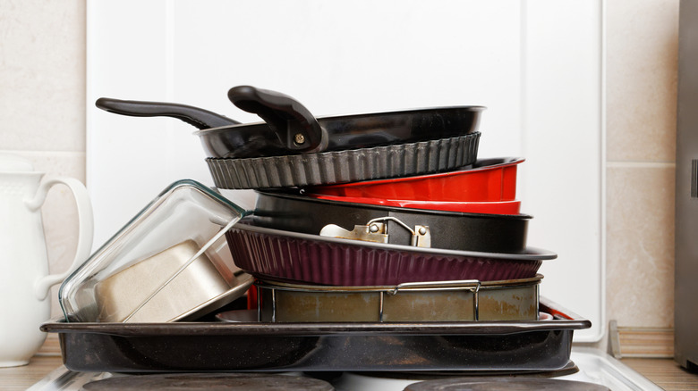 A pile of pans in the kitchen.