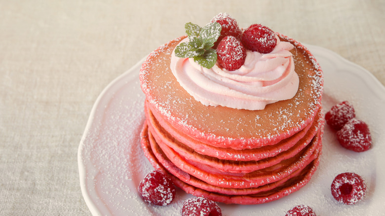 Red velvet pancakes with powdered sugar