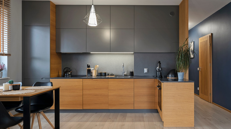 A stylish modern kitchen with grey cabinets and countertops
