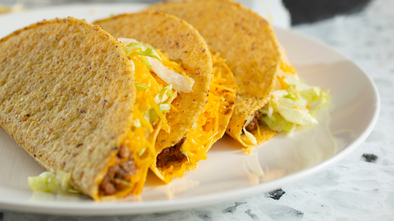 hard shell tacos served on plate