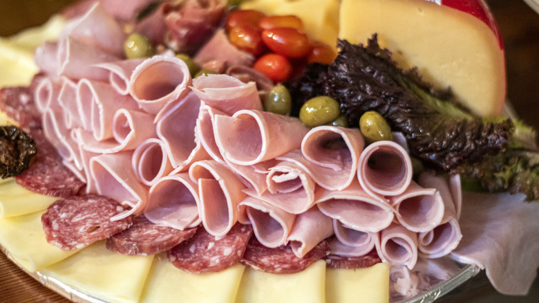 A selection of deli meats and cheeses.