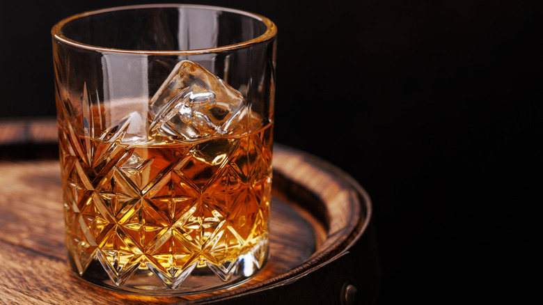 Glass of whiskey served with ice