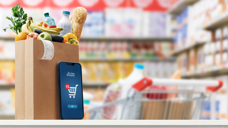 Cartoon- like grocery store bags with online grocery delivery or pickup phone app