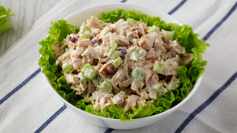 Homemade chicken salad with lettuce in a white bowl