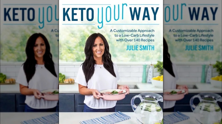 cook holding casserole dish