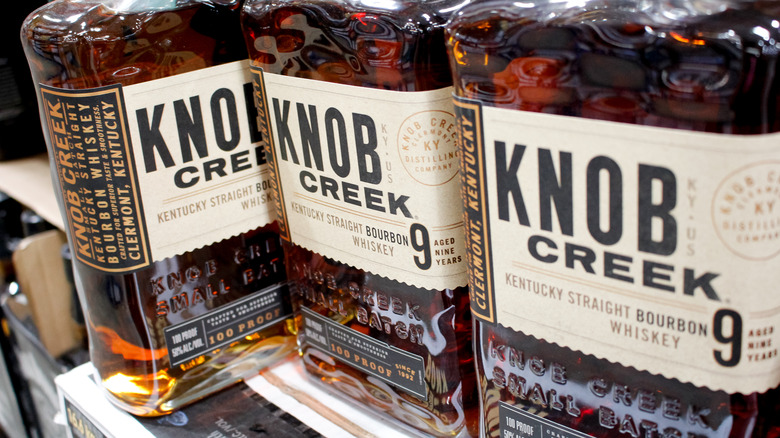 Three bottles of Knob Creek 9 year on a shelf