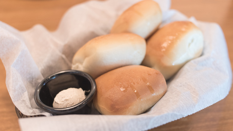 Basket of rolls served with honey cinnamon butter