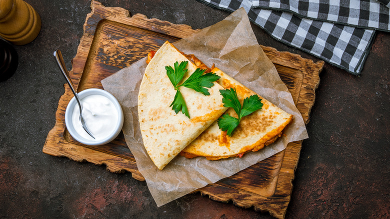 Buffalo chicken quesadillas on cutting board